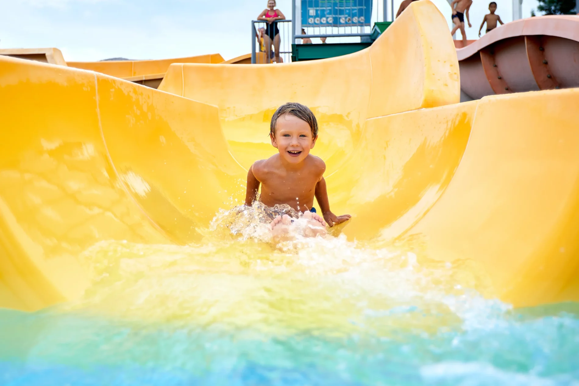 kid descends from the water slide in the summer in 2023 05 13 00 40 21 utc Mallorca's water parks: discover them