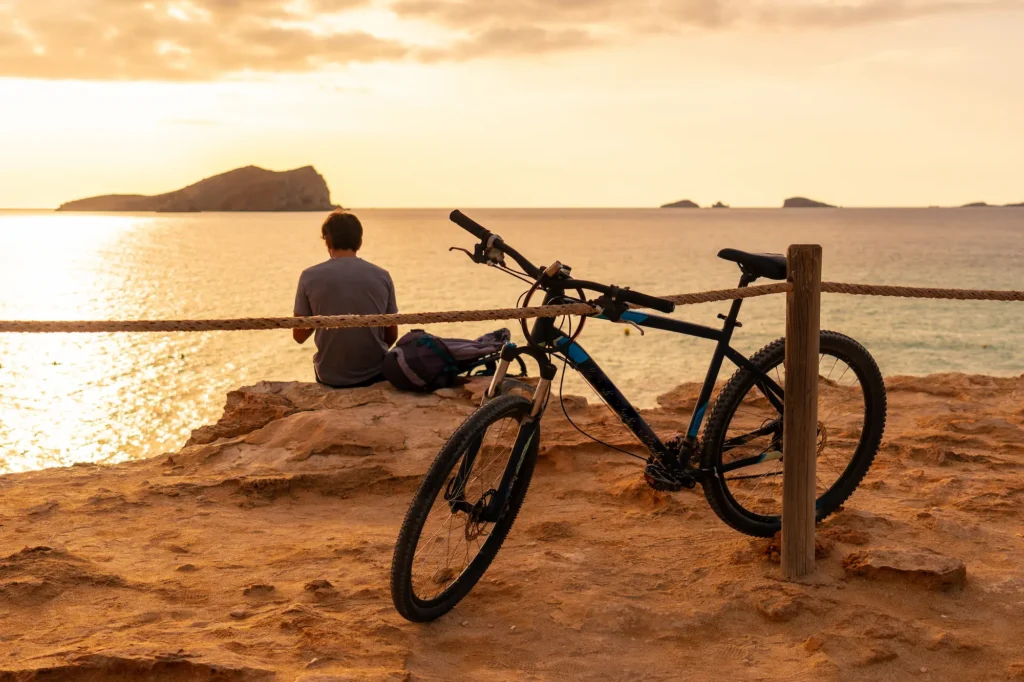 a tourist cycling on cala comte beach on the islan 2024 12 10 01 12 51 utc Tour en Bici en Mallorca