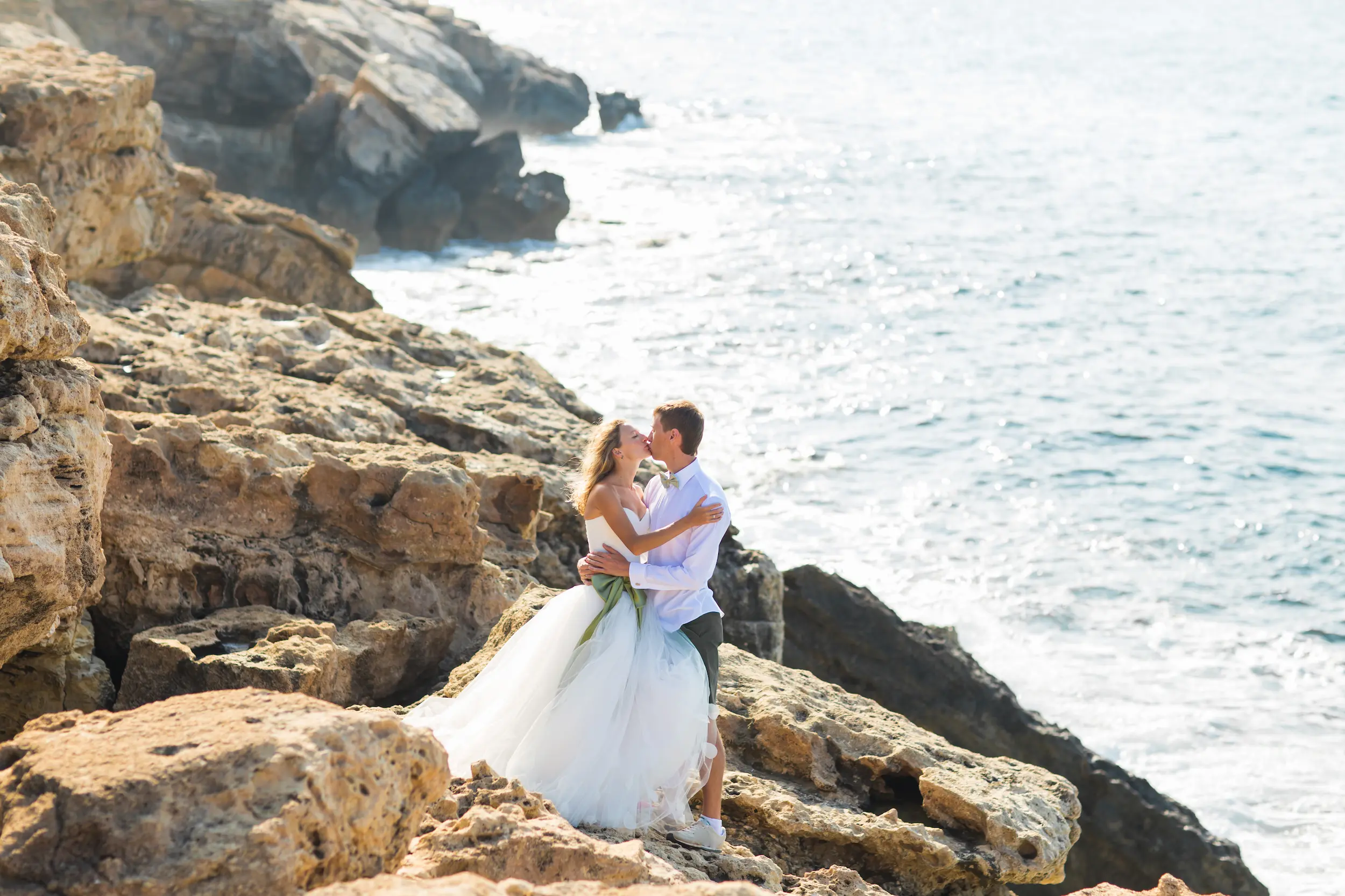 cheerful-married-couple-standing-on-the-beach-2025-02-24-12-06-53-utc
