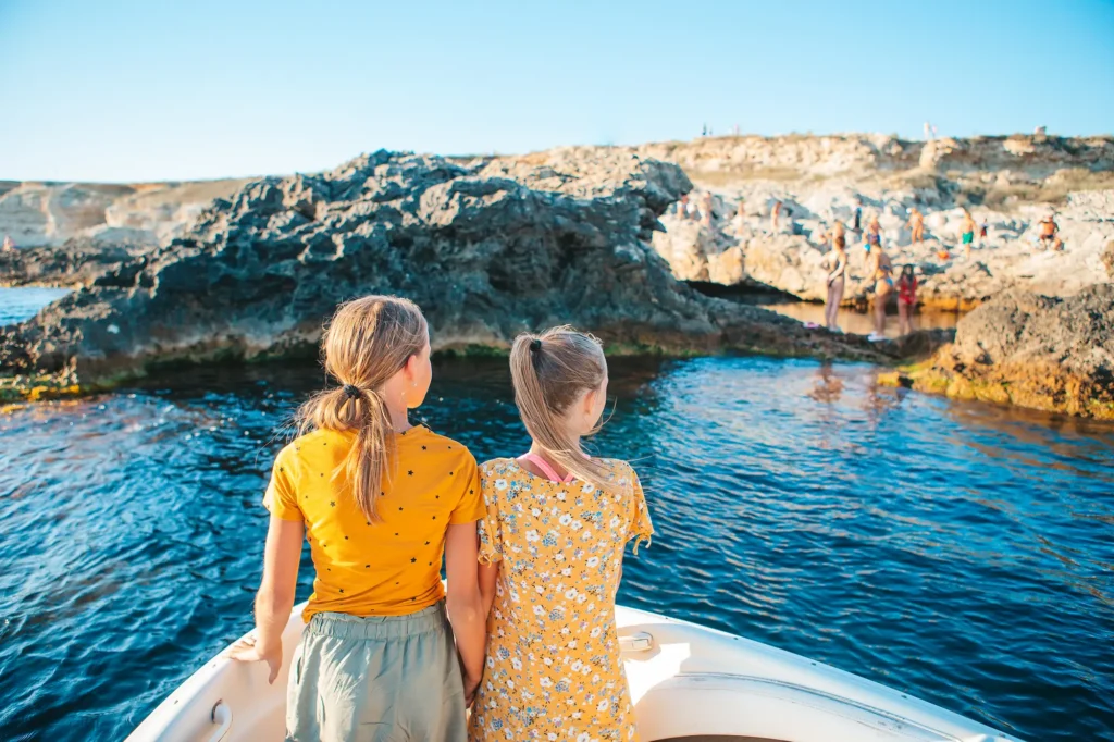 little girls sailing on boat in clear open sea 2025 02 12 03 18 37 utc Mallorca with the family: fun plans for all ages