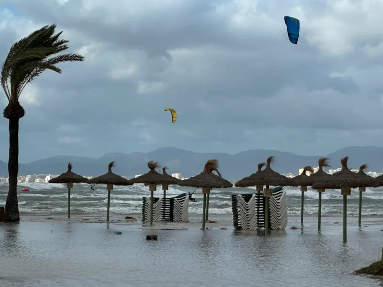 beach umbrellas on flooded sandy tropical beach wi 2025 02 24 17 27 30 utc Polígono Son Oms