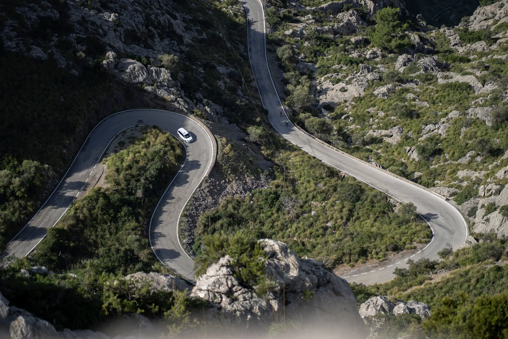 aerial-view-of-a-car-driving-on-a-highway-road-in-2026-03-18-05-41-37-utc (1)