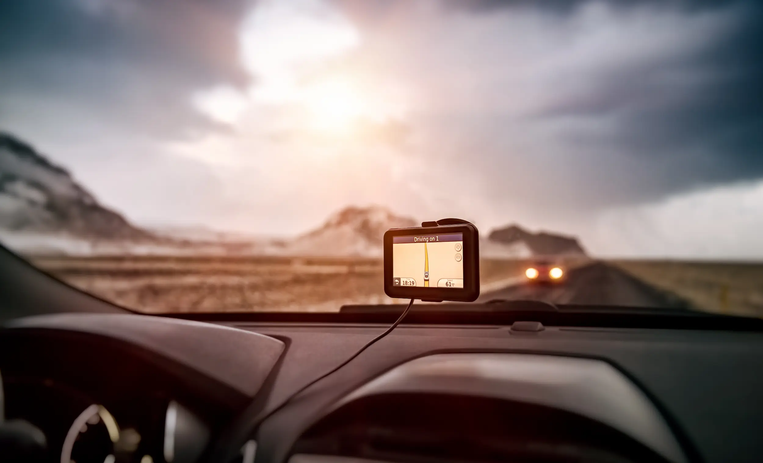 gps-navigation-device-on-car-dashboard-in-nature-2026-03-20-00-05-55-utc